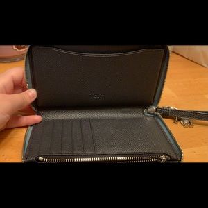 COACH Small clutch handbag. Black + teal